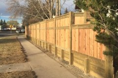 Fences - pressure treated retaining wall topped with cedar fence