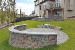 curved-decorative-wall-boulders-mow-brick-crushed-gravel