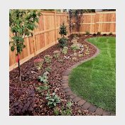 brown mow brick border and mulch beds in backyard